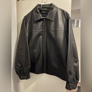 Women’s black leather jacket.